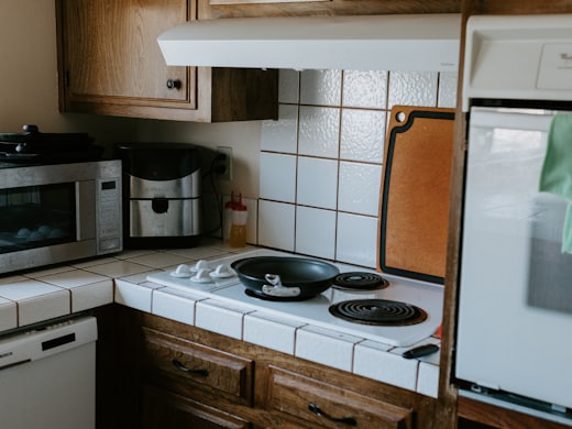 Cascais villa kitchen before renovation, 1980s tiled fit-out