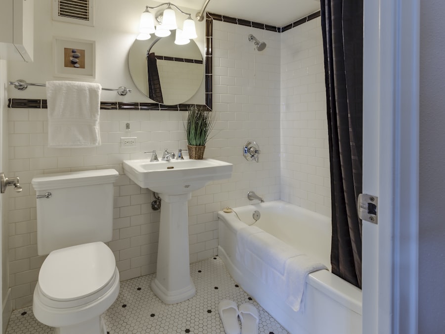 Alfama bathroom after renovation, white tile and refitted services