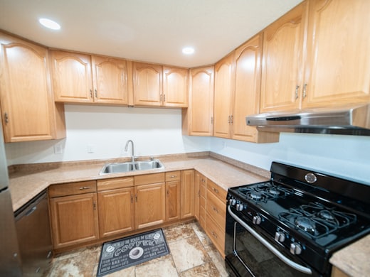 A kitchen photographed for three bids, none of which opened a wall