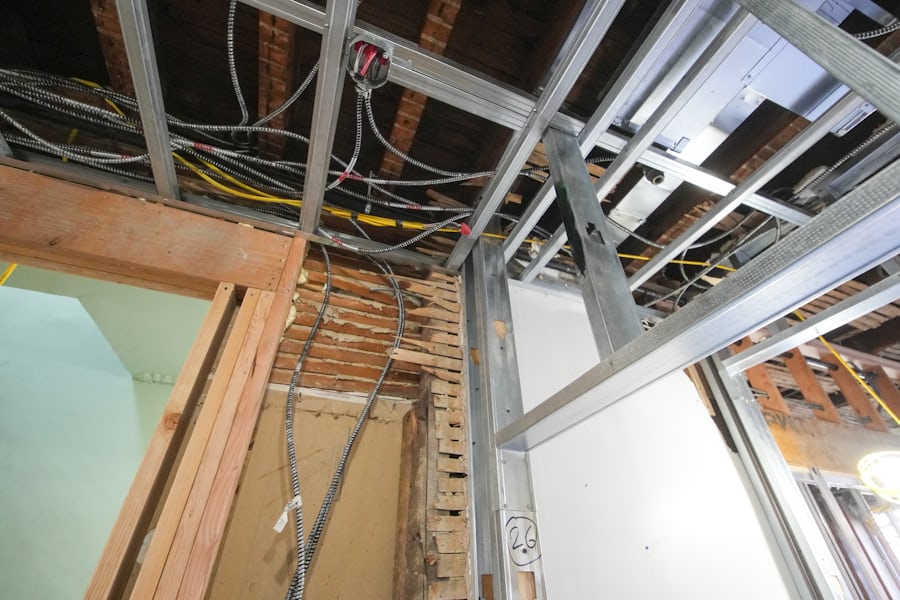 Ceiling void opened, services and thermal bridges exposed